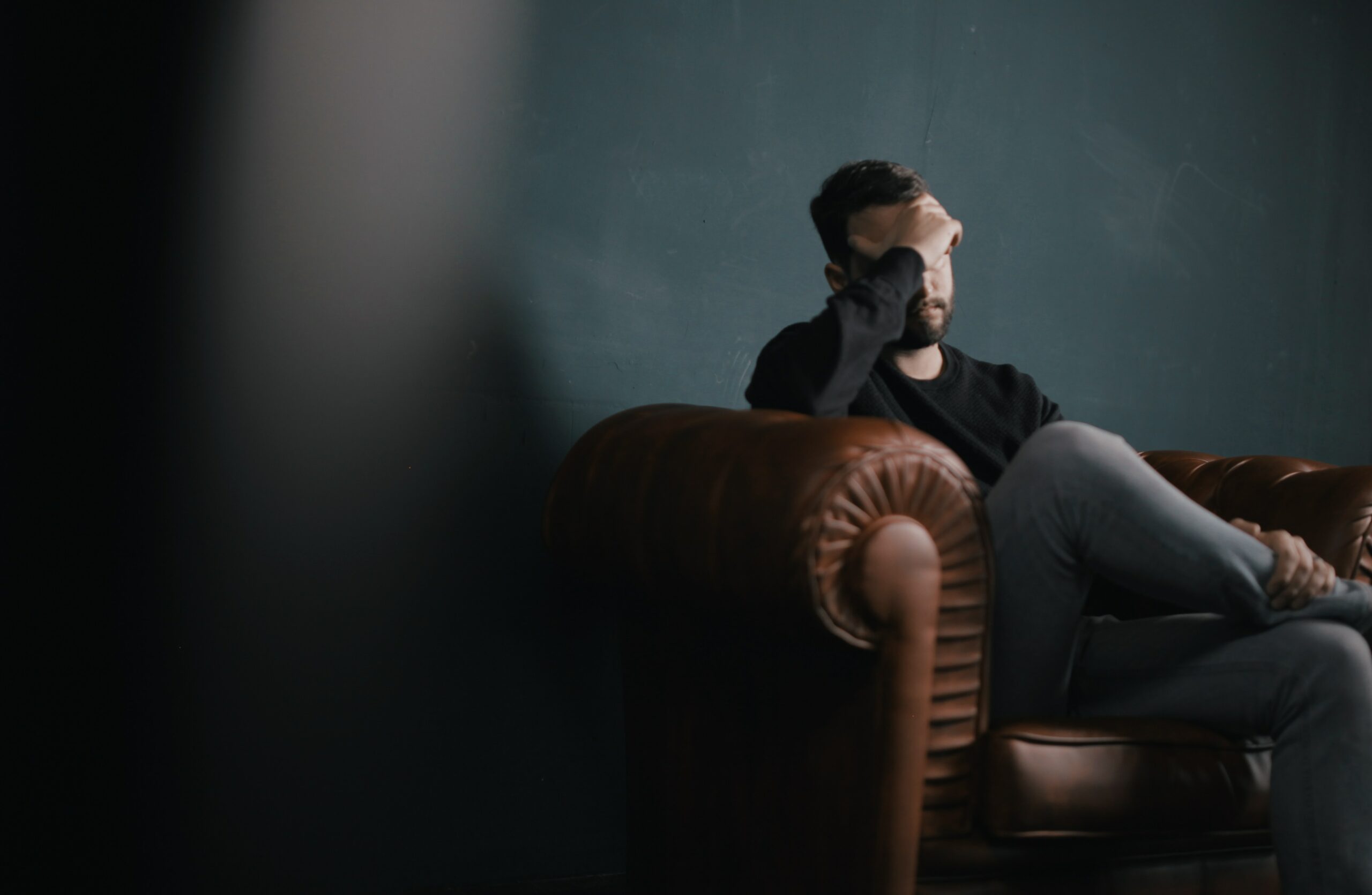 man sitting on the sofa